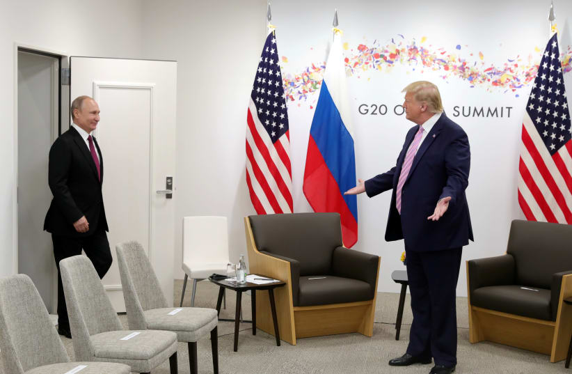 Russian President Vladimir Putin and US President Donald Trump at the G20 summit in Osaka, Japan June 28, 2019 (photo credit: SPUTNIK/MIKHAIL KLIMENTYEV/KREMLIN VIA REUTERS)
