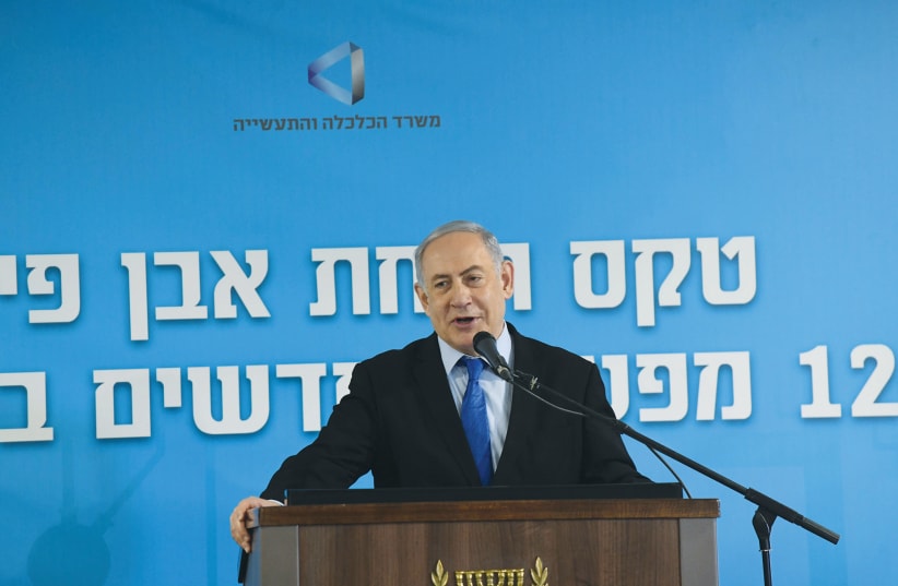 Prime Minister Benjamin Netanyahu addresses a ceremony to inaugurate a dozen factories in Ashkelon on December 2, 2019 (photo credit: REUTERS)