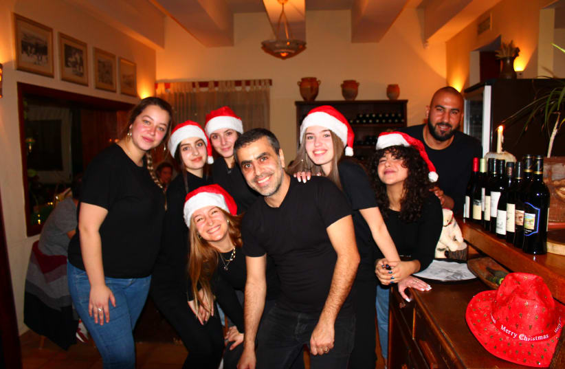 Aluma Gallilean Bistro owner Alaa Sweitat spreads holiday cheer at his annual Christmas Dinner in Tarshiha (photo credit: WESTERN GALILEE NOW)
