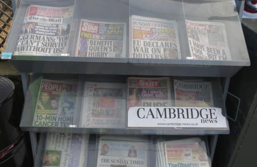 A newspaper rack in the United Kingdom (photo credit: REUTERS)