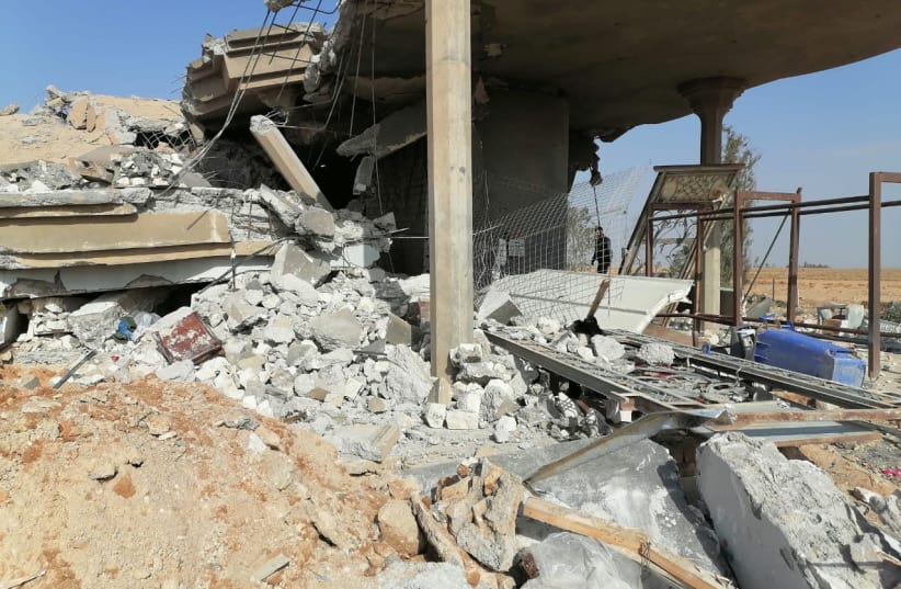 Destroyed headquarters of Kataib Hezbollah militia group are seen after in an air strike in Qaim, Iraq, December 30, 2019 (photo credit: REUTERS/STRINGER)