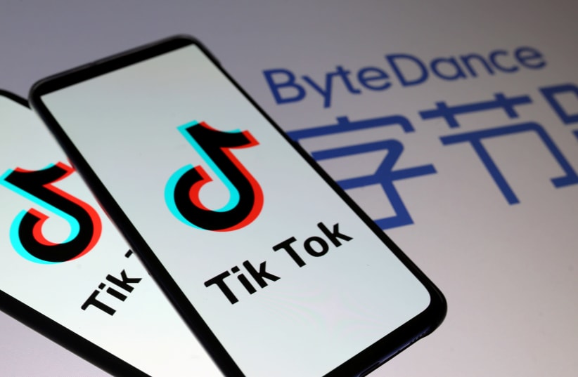 Tik Tok logos are seen on smartphones in front of displayed ByteDance logo in this illustration (photo credit: REUTERS)
