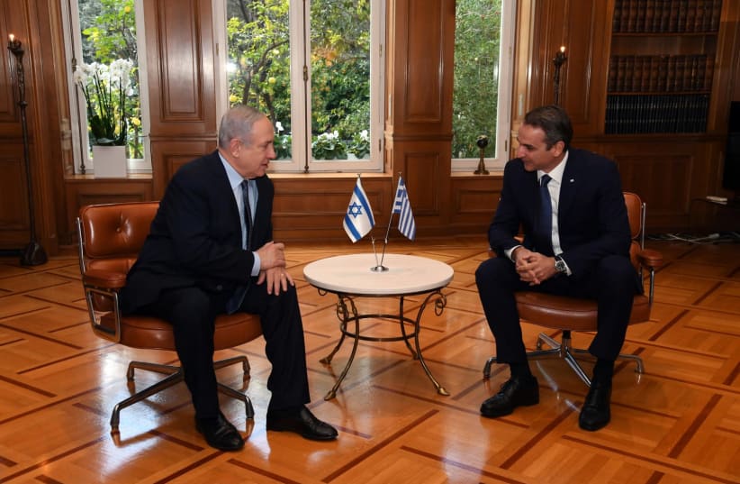 Prime Minister Benjamin Netanyahu [L] with Greek Prime Minister Kyriakos Mitsotakis [R].   (photo credit: HAIM ZACH/GPO)