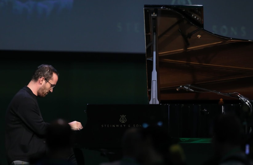World-class pianist Igor Levit, picutred at the German federal party conference of Alliance 90/The Greens on Nov. 9, 2018 in Saxony, Leipzig, received an antisemitic death threat in November 2019. (photo credit: JTA/JAN WOITAS/PICTURE ALLIANCE VIA GETTY IMAGES)