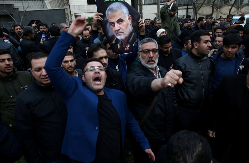 FILE PHOTO: Iranian demonstrators react during a protest against the killing of the Iranian Major-General Qassem Soleimani, head of the elite Quds Force, and Iraqi militia commander Abu Mahdi al-Muhandis, who were killed in an air strike at Baghdad airport, in front of United Nations office in Tehra (photo credit: NAZANIN TABATABAEE/WANA (WEST ASIA NEWS AGENCY) VIA REUTERS)