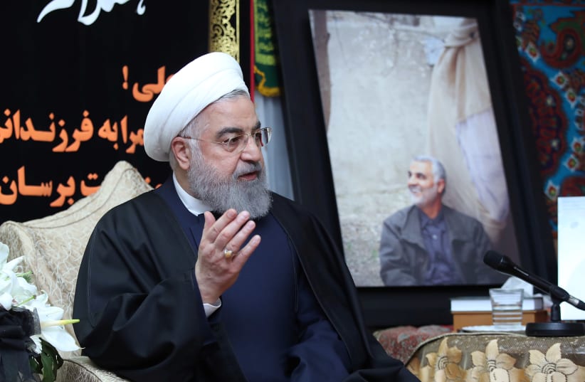 Iranian President Hassan Rouhani visits the family of the Iranian Major-General Qassem Soleimani, head of the elite Quds Force, who was killed by an air strike in Baghdad, at his home in Tehran, Iran January 4, 2020 (photo credit: OFFICIAL PRESIDENT WEBSITE/HANDOUT VIA REUTERS)