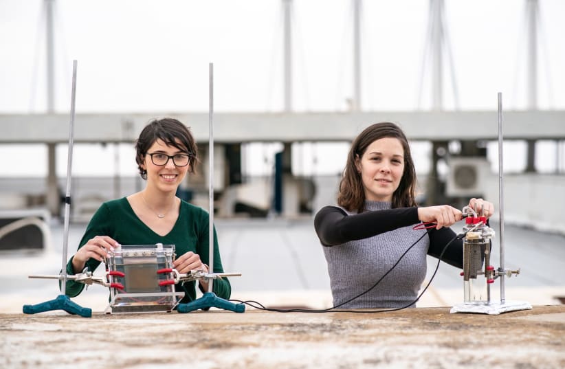 PhD student Avigail Landman (right) and masters student Rawan Halabi with the innovative water-splitting system. (photo credit: Courtesy)