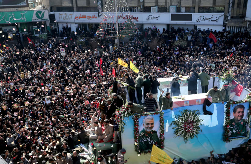 Iranian people attend a funeral procession and burial for Iranian Major-General Qassem Soleimani, head of the elite Quds Force, who was killed in an air strike at Baghdad airport, at his hometown in Kerman, Iran January 7, 2020 (photo credit: MEHDI BOLOURIAN/FARS NEWS AGENCY/WANA (WEST ASIA NEWS AGENCY) VIA REUTERS)