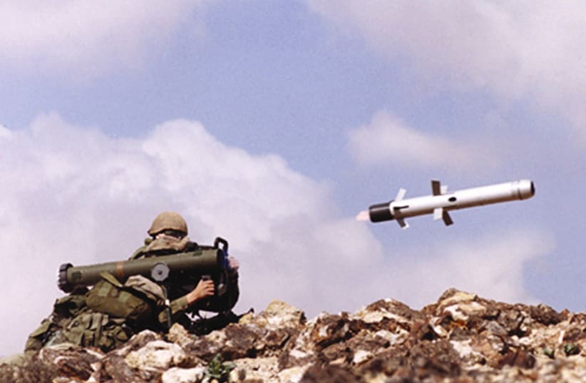 An undated file picture shows an Israeli soldier firing an anti-tank missile Spike-LR, manufactured by an Israeli Defense contractor. Israeli Defense Ministry said December 29, 2003, it signed a deal worth about $250 million to produce and supply anti-tank missiles to Poland. (photo credit: RAFAEL ADVANCED SYSTEMS)