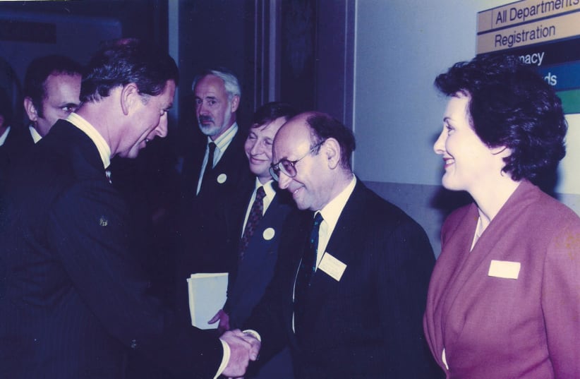 The writer, then a director of a UK cancer charity, meets its patron, Prince Charles, in 1994 (photo credit: Courtesy)