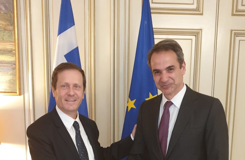 Jewish Agency Chairman Isaac Herzog (left) is seen shaking hands with Greek Prime Minister Kyriakos Mitsotakis (photo credit: THE JEWISH AGENCY FOR ISRAEL)