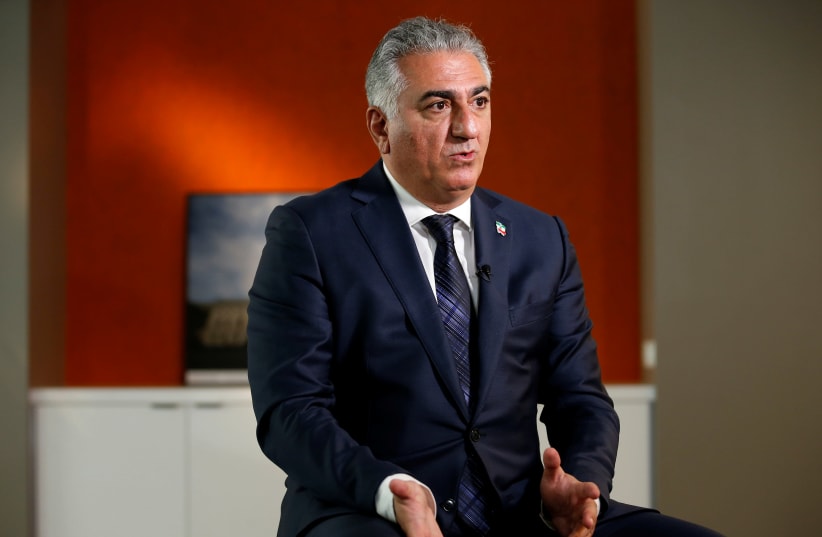 Reza Pahlavi, the last heir apparent to the defunct throne of the Imperial State of Iran and the current head of the exiled House of Pahlavi speaks during an interview with Reuters in Washington, U.S., January 3, 2018. (photo credit: REUTERS/JOSHUA ROBERTS)
