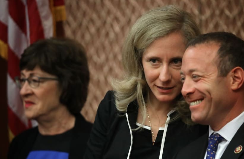Rep. Abigail Spanberger (C) (D-VA) confers with Rep. Josh Gottheimer (R) (D-NJ) during a press conference held by the bipartisan and bicameral Problems Solvers Caucus at the U.S. Capitol in Washington, DC on June 27, 2019 (photo credit: WIN MCNAMEE/GETTY IMAGES/JTA)