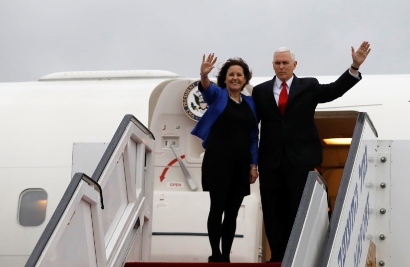 U.S. Vice President Mike Pence and his wife Karen wave as they board an airplane ahead of their departure from Ben Gurion International airport in Lod, near Tel Aviv (photo credit: REUTERS/Ronen Zvulun)