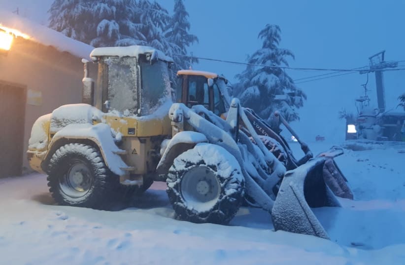 Snow plows covered in snow on Mount Hermon on January 21, 2020 (photo credit: MT. HERMON)