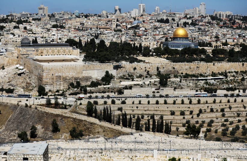 A general view of Jerusalem as seen from the Mount of Olives shows the Dome of the Rock, located in Jerusalem's Old City on the compound known to Muslims as Noble Sanctuary and to Jews as Temple Mount, June 21, 2018 (photo credit: REUTERS/AMMAR AWAD)