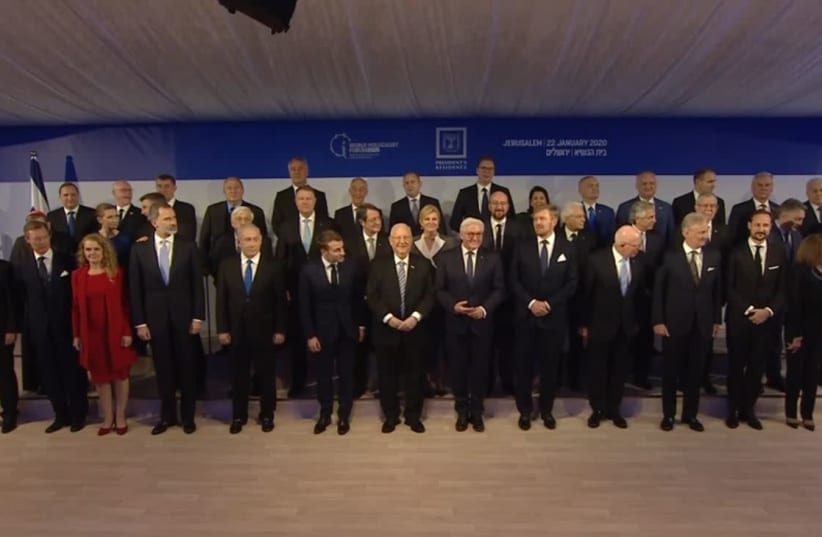 President Reuven Rivlin [C] and world leaders in a group photo taken in Jerusalem January 22 2020  (photo credit: screenshot)