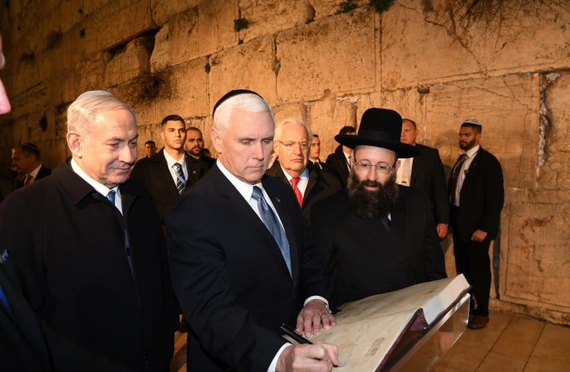Prime Minister Benjamin Netanyahu [L] and US Vice President Mike Pence at the Western Wall    (photo credit: AMOS BEN-GERSHOM/GPO)