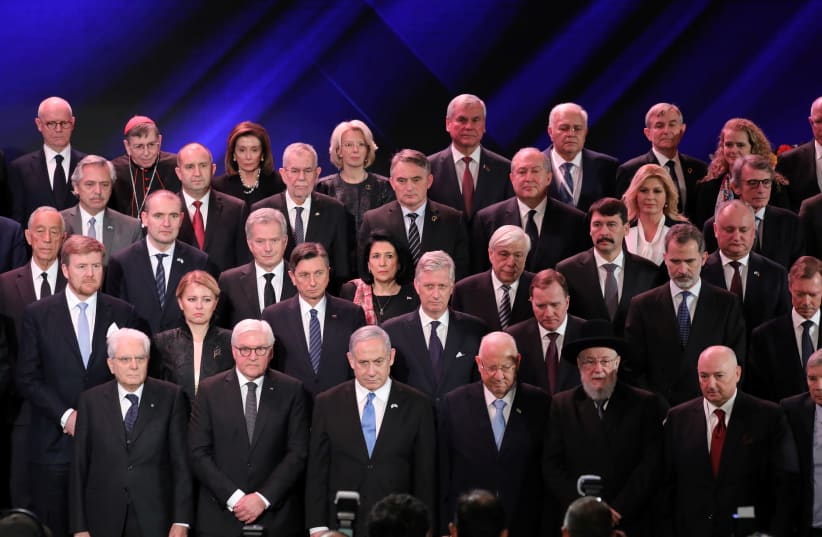 Israeli Prime Minister Benjamin Netanyahu (C-L) and Israeli President Reuven Rivlin (C-R) with world leaders pose for a family photo during the Fifth World Holocaust Forum at the Yad Vashem Holocaust memorial museum in Jerusalem, January 23, 2020 (photo credit: ABIR SULTAN/POOL/VIA REUTERS)