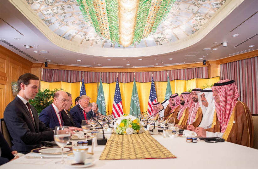 White House senior adviser Jared Kushner, and Saudi Arabia's Minister of State for Foreign Affairs Adel al-Jubeir are seen as U.S. President Donald Trump holds a working breakfast meeting with Saudi Arabia's Crown Prince Mohammed bin Salman during the G20 leaders summit in Osaka, Japan, June 29, 201 (photo credit: BANDAR ALGALOUD / SAUDI ROYAL COURT / REUTERS)