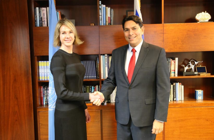 Danny Danon and Kelly Craft shaking hands (photo credit: ISRAELI DELEGATION TO THE UN)