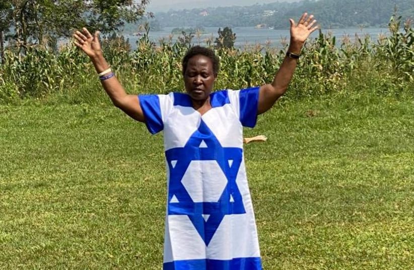 African woman prays for Israel (photo credit: Courtesy)