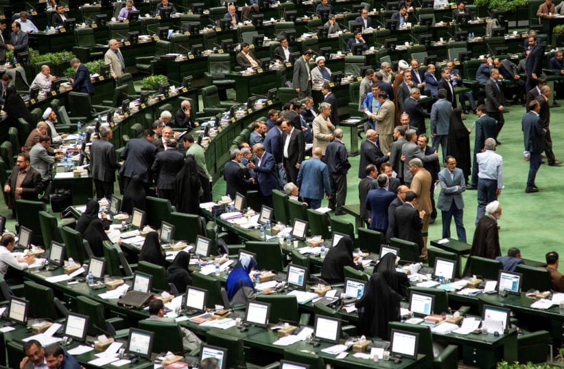 FILE PHOTO: Iranian lawmakers attend a session of parliament in Tehran, Iran July 16, 2019 (photo credit: NAZANIN TABATABAEE/WANA (WEST ASIA NEWS AGENCY) VIA REUTERS)