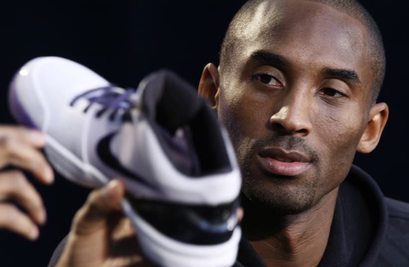 NBA Los Angeles Lakers star Kobe Bryant speaks at a webcast to unveil his new Nike Zoom Kobe IV basketball shoe in Los Angeles (photo credit: REUTERS)