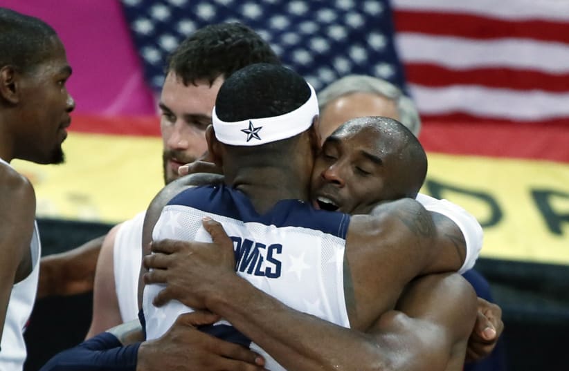 Lebron James (L) of the U.S.celebrates with teammate Kobe Bryant during their men's gold medal basketball match against Spain at the North Greenwich Arena in London during the London 2012 Olympic Games August 12, 2012 (photo credit: REUTERS)