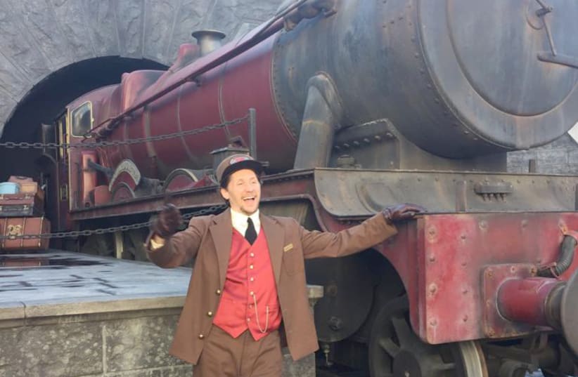  A MAKE-BELIEVE conductor poses before an imaginary trip to Hogwarts. . (photo credit: SUSSIE WEISS)
