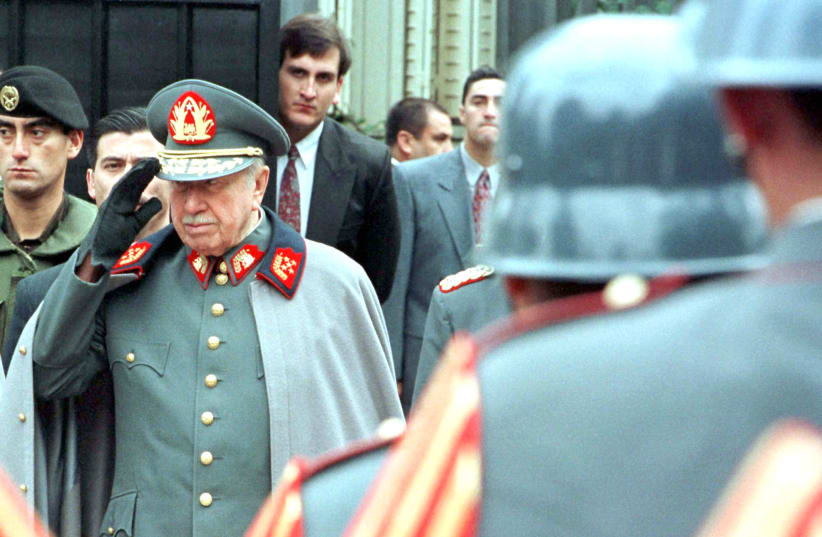CHILEAN GENERAL Augusto Pinochet (in 1973) is one of various historical figures who make appearances in the fictional work. (photo credit: REUTERS)