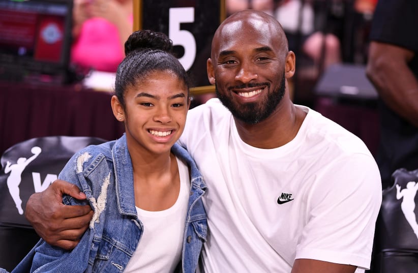 FILE PHOTO: Jul 27, 2019; Las Vegas, NV, USA; Kobe Bryant is pictured with his daughter Gianna at the WNBA All Star Game at Mandalay Bay Events Center (photo credit: STEPHEN R. SYLVANIE-USA TODAY SPORTS/FILE PHOTO VIA REUTERS)
