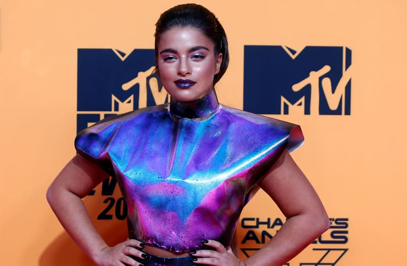 Noa Kirel poses on a red carpet as she arrives at the 2019 MTV Europe Music Awards at the FIBES Conference and Exhibition Centre in Seville, Spain, November 3, 2019 (photo credit: JON NAZCA/ REUTERS)
