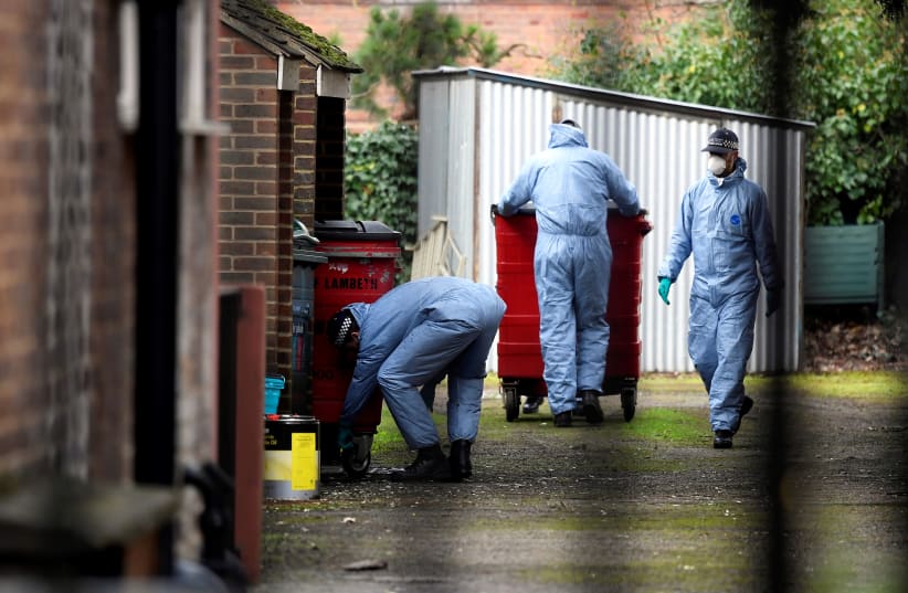 Police forensic officers arrive at a residential address in Streatham, south London, Britain, February 3, 2020 (photo credit: TOBY MELVILLE/REUTERS)