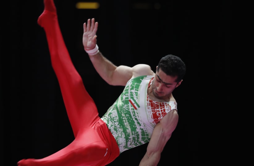Gymnast Saeedreza Keikha of Iran at 2018 Asian Games (photo credit: CATHAL MCNAUGHTON/REUTERS)
