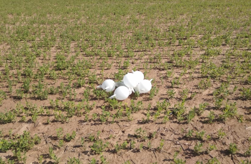 Balloons attached to an explosive charge landed in an open field near Sderot (photo credit: POLICE SPOKESPERSON'S UNIT)