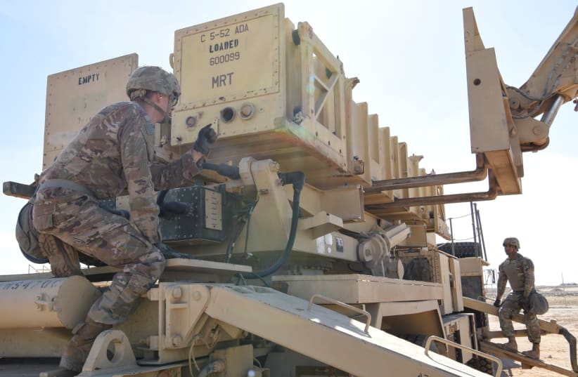 Specialist Tevin Howe and Specialist Eduardo Martinez take part in training on a U.S. Army Patriot surface-to-air missile launcher at Al Dhafra Air Base, United Arab Emirates, January 12, 2019. Picture taken January 12, 2019. U.S. Air Force/Tech (photo credit: SGT. DARNELL T. CANNADY/HANDOUT VIA REUTERS)