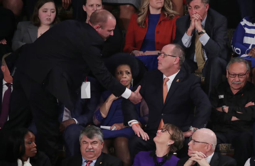Fred Guttenberg, father of Parkland school shooting victim Jaime Guttenberg, is ejected after shouting during U.S. President Donald Trump's State of the Union address to a joint session of the U.S. Congress in the House Chamber of the U.S. Capitol in Washington, U.S. February 4, 2020 (photo credit: REUTERS/TOM BRENNER)