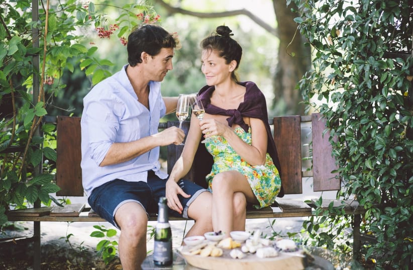 A couple share a romantic glass of champagne in the Golan Heights (photo credit: Courtesy)