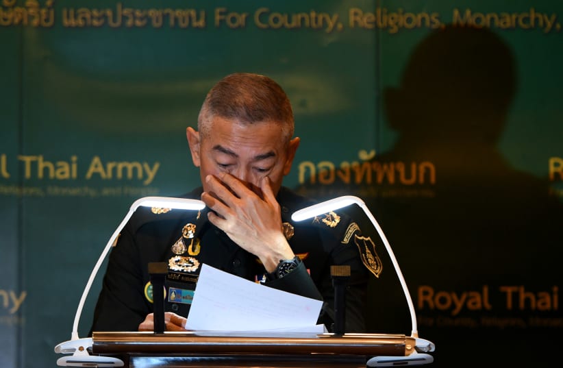 Thai army chief Apirat cries during a news conference in Bangkok following last weekend's shooting rampage in Nakhon Ratchasima (photo credit: REUTERS)