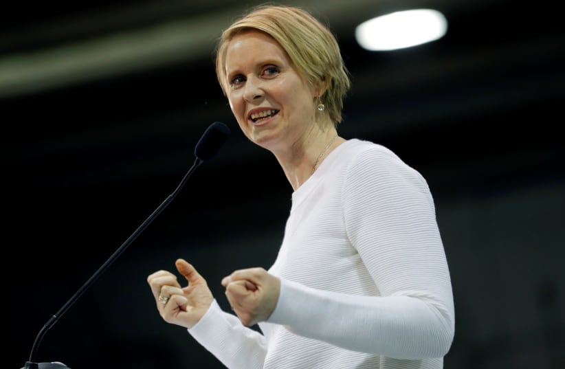 Actress Cynthia Nixon introduces Democratic U.S. presidential candidate Senator Bernie Sanders during a campaign rally one day before the New Hampshire presidential primary election in Rindge, New Hampshire, U.S., February 10, 2020 (photo credit: REUTERS/MIKE SEGAR)