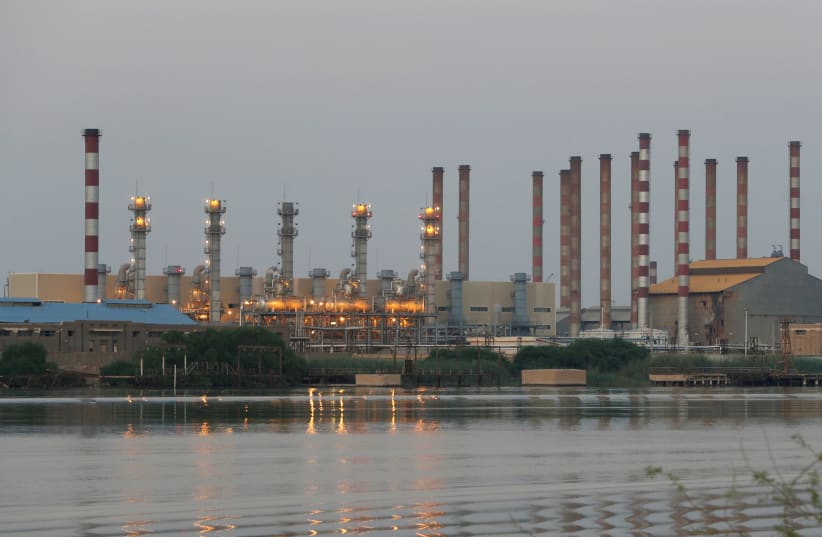 A general view of Abadan oil refinery in southwest Iran, is pictured from Iraqi side of Shatt al-Arab in Al-Faw south of Basra, Iraq September 21, 2019 (photo credit: REUTERS/ESSAM AL-SUDANI)