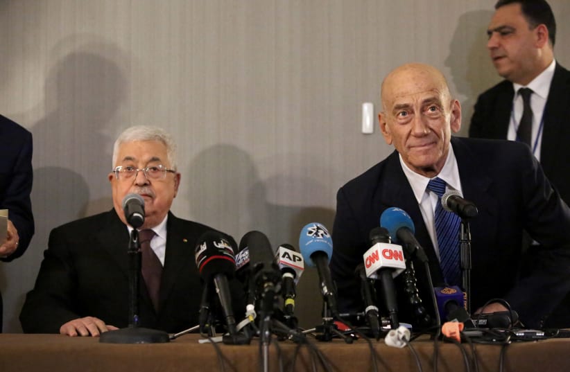 Palestinian President Mahmoud Abbas and former Israeli Prime Minister Ehud Olmert hold a news conference in New York (photo credit: REUTERS)