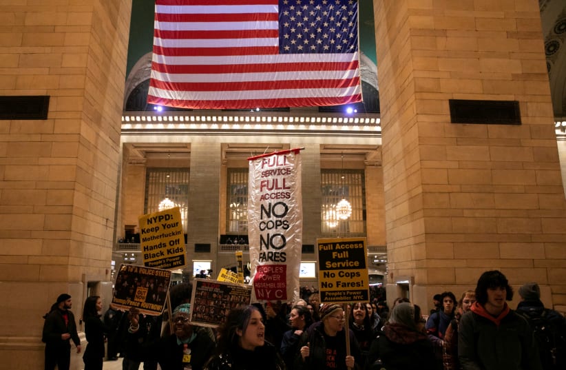 Demonstrators protest an increased New York Police Department presence in the subway system at Grand Central in the Manhattan borough of New York City (photo credit: REUTERS)