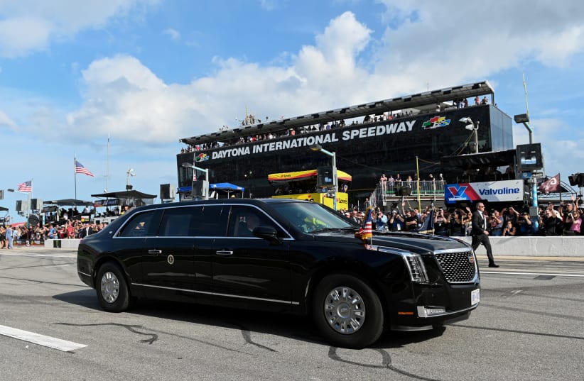 The motorcade carrying U.S. President Donald Trump and first lady Melania Trump drives on the NASCAR Daytona 500 racetrack (photo credit: REUTERS)