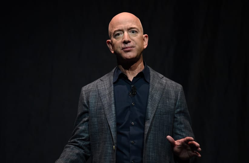 FILE PHOTO: Founder, Chairman, CEO and President of Amazon Jeff Bezos speaks during an event about Blue Origin's space exploration plans in Washington (photo credit: REUTERS)