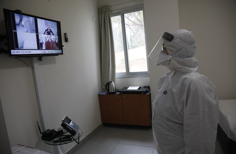 An employee at Sheba Medical Center at Tel Hashomer testing the special area where the Israelis who were aboard the Diamond Princess cruise ship will be kept in quarantine (photo credit: SHAUL GOLAN)