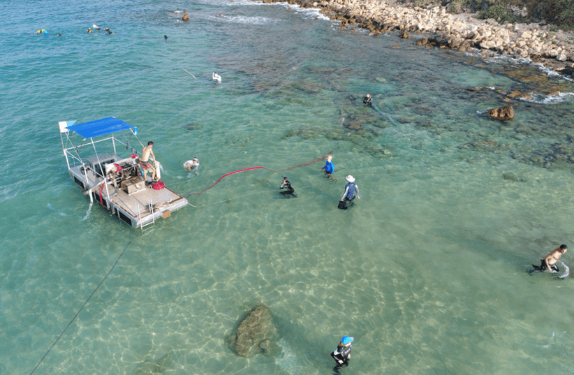 Nearshore excavation with newly developed barge system at Biblical port of Tel Dor, Israel.  (photo credit: ANTHONY TAMBERINO/ SCMA)