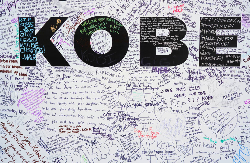 Walls for fans to write tributes to Kobe Bryant in Microsoft Square near the Staples Center after a helicopter crash killed the retired basketball star, in Los Angeles, California, U.S., January 28, 2020 (photo credit: REUTERS/KYLE GRILLOT)