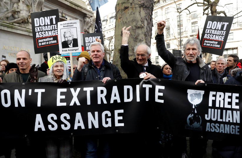 Former Greek Finance minister Yanis Varoufakis, fashion designer Vivienne Westwood, editor in chief of WikiLeaks Kristinn Hrafnsonn, Assange's Father John Shipton and singer Roger Waters attend a protest against the extradition of Julian Assange outside the Australian High Commission in London, Brit (photo credit: REUTERS)
